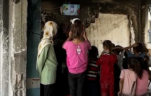 Thumbnail preview image for the video titled: Palestinian teenagers raise children's spirits with solar power and entertainment