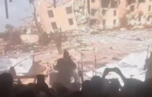Thumbnail preview image for the video titled: An Israeli group broadcasts footage of Gaza under bombardment during a concert in front of a frenzied crowd
