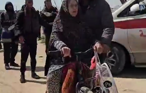 Thumbnail preview image for the video titled: Young man transports his elderly mother on a bicycle amid forced displacement from Rafah