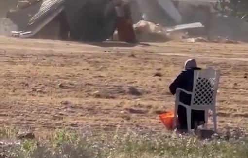 Thumbnail preview image for the video titled: Palestinian woman sits and watches as the settler forces bulldoze her house in the Negev