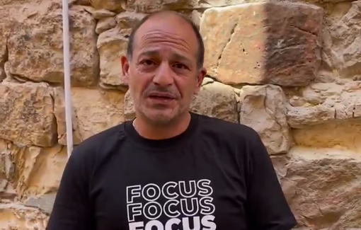 Thumbnail preview image for the video titled: "We get spit on everyday. Wearing a cross, you will get spit on in this neighbourhood."