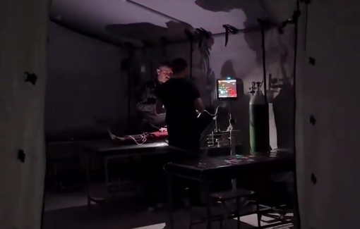 Thumbnail preview image for the video titled: Child being treated under mobile phone light due to fuel shortages at hospitals