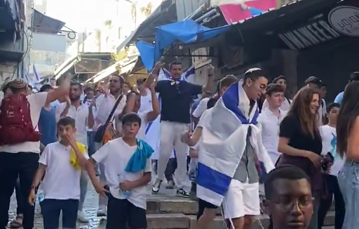 Thumbnail preview image for the video titled: Marchers chant “May your village burn” as they walk through the Muslim quarter during the Flag Day