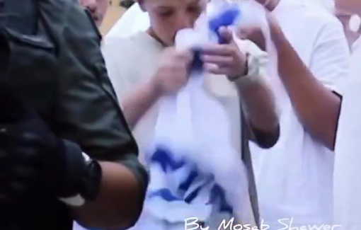 Thumbnail preview image for the video titled: Jewish settler children taunt Palestinians with gestures and Israeli flag in Al-Khalil/Hebron