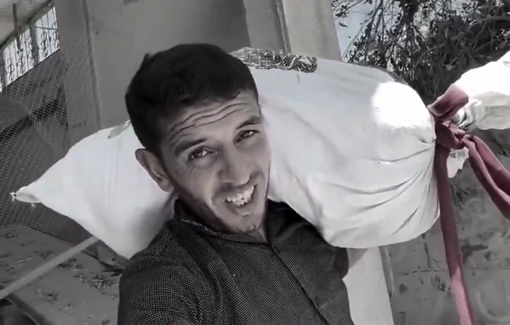 Thumbnail preview image for the video titled: Young man risks his life to get a bag of rice from his home as drones hover over him