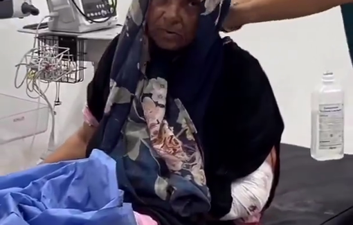 Thumbnail preview image for the video titled: Elderly mother barely conscious after being injured in Israeli shooting of aid seekers