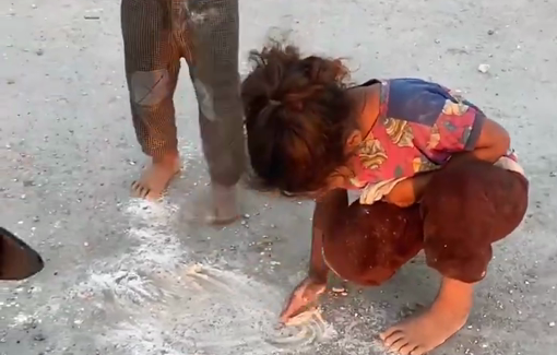 Thumbnail preview image for the video titled: Small children picking up flour from the ground to feed their families