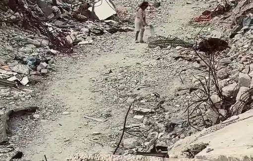 Thumbnail preview image for the video titled: Little girl plays alone amidst the rubble
