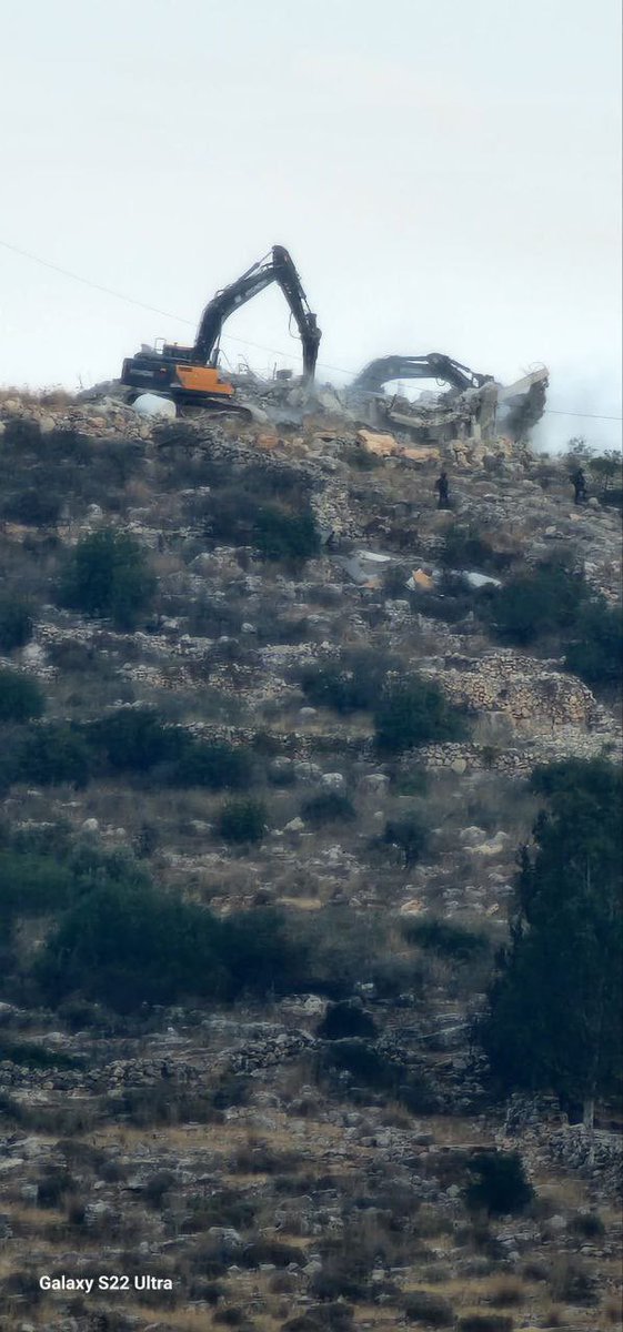 Thumbnail preview image for the video titled: Israeli army bulldozers demolishing a Palestinian-owned house right now in the village of Shuqba