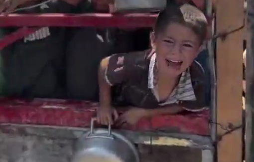 Thumbnail preview image for the video titled: A child in Gaza is crying from hunger amid the crowd at a charity kitchen