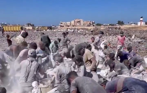 Thumbnail preview image for the video titled: Desperate civilians forced to scrape up flour mixed with sand just to keep their families alive