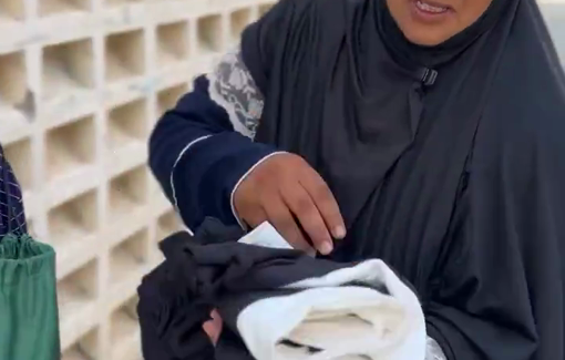 Thumbnail preview image for the video titled: Mother sells daughter's Eid clothes after she was killed at GHF site