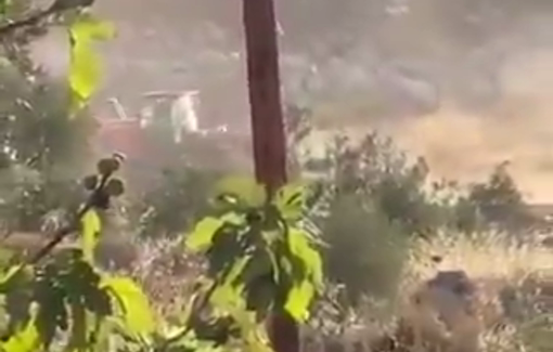 Thumbnail preview image for the video titled: Using bulldozers, Israeli settlers are levelling Palestinian lands near the town of Turmus Ayya