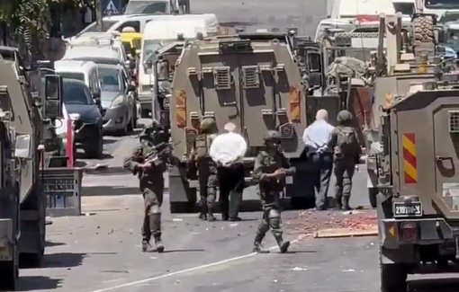 Thumbnail preview image for the video titled: Israeli army arresting two elderly men during a raid on Ramallah