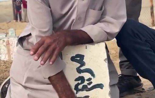 Thumbnail preview image for the video titled: Father of journalist Mariam Abu Dagga mourns at her grave