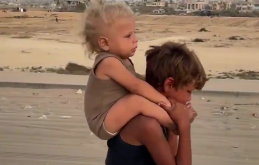 Thumbnail preview image for the video titled: Israel's forced displacement of Palestinians leaves distraught child Jadwa carrying his little brother Khaled on his shoulders from Gaza City