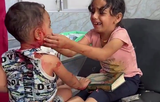 Thumbnail preview image for the video titled: Iinjured little girl clutches the Quran as she comforts her wounded brother