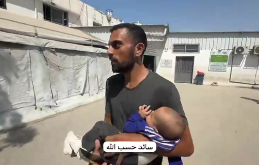 Thumbnail preview image for the video titled: Photojournalist Hammam Al-Zaytouniya rushes his daughter to hospital after Israel struck his home