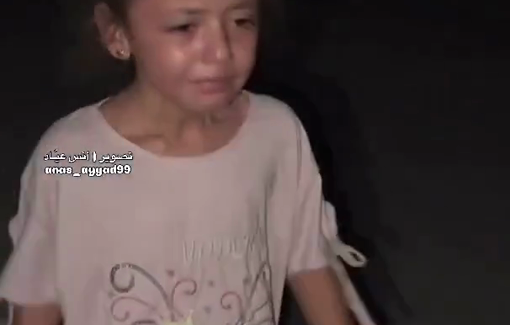 Thumbnail preview image for the video titled: Little girl cries while limping after Israel forced families to be displaced from their shelters in the Rimal neighborhood