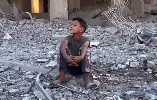 Thumbnail preview image for the video titled: Child sits atop the rubble of what was his home in the Sabra neighborhood