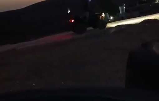 Thumbnail preview image for the video titled: Israeli settlers drive ATV near Palestinian homes at night in Khirbet al-Mafqara