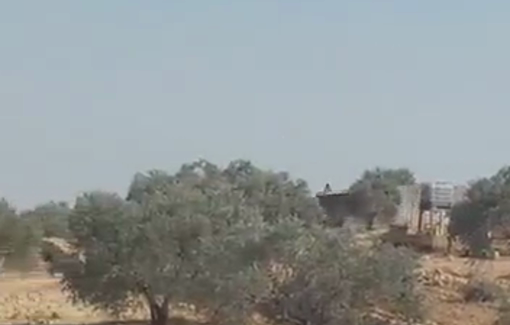 Thumbnail preview image for the video titled: Settlers and soliders prevent olive harvest in Wadi al-Hajj Issa by force and arrest