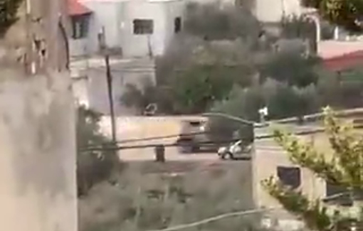 Thumbnail preview image for the video titled: Gunfire from the Israeli's helicopter and sounds of explosions in the vicinity of the besieged house in the village of Marka