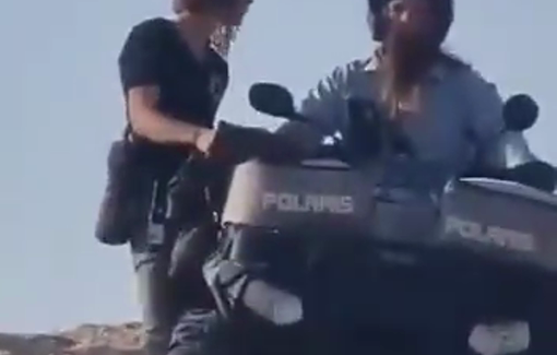 Thumbnail preview image for the video titled: Settlers driving Polaris Rangers prevent Palestinian shepherds from accessing their lands in the Bedouin community of Al-Hathroura