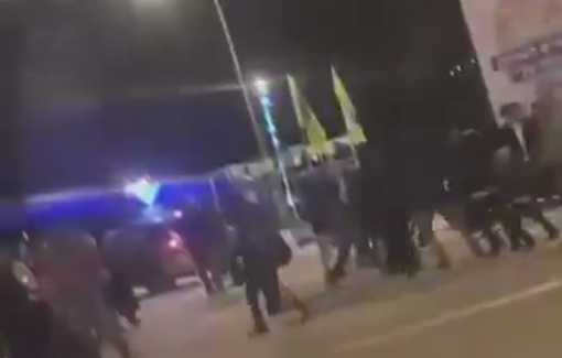 Thumbnail preview image for the video titled: Settlers dancing and singing for Hanukka at the entrance of Palestinian town of Sinjil