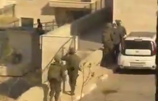 Thumbnail preview image for the video titled: The Israeli army detains a university professor in Birzeit and drags him inside the university campus.