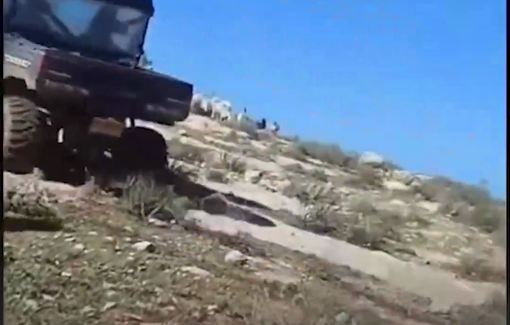 Thumbnail preview image for the video titled: An Israeli settler try to run over Palestinian Shpherds in Huwara area of Masafer Yatta