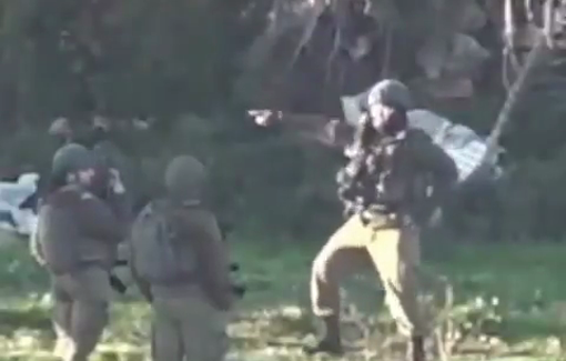 Thumbnail preview image for the video titled: A soldier dancing while Israeli bulldozers carrying out a demolition order in the town of Beit Ummar