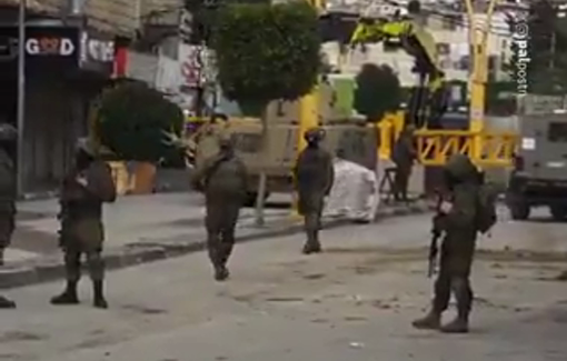 Thumbnail preview image for the video titled: Israeli forces dismanteling terrorism in Hebron by uprooting trees...
