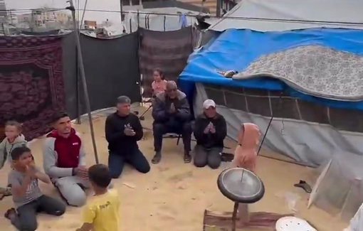 Thumbnail preview image for the video titled: Using the simplest of tools, young Hossam Qassem managed to create a “drum kit” to play amidst the tents