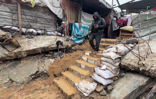 Thumbnail preview image for the video titled: For 200 days, Abu Ismail Hammad has been sifting the sand with a flour strainer to recover the remains of his wife and unborn child