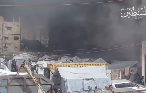 Thumbnail preview image for the video titled: A large fire broke out in one of the aid warehouses on Al-Thawra Street in Gaza City, threatening dozens of nearby tents