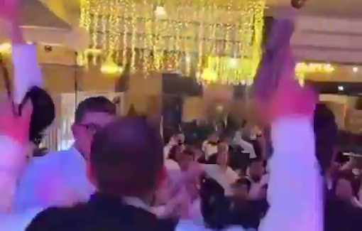 Thumbnail preview image for the video titled: Crowd is dancing and waving knives and guns to the sound of "May your village burn" song at an ultra-Orthoodox wedding