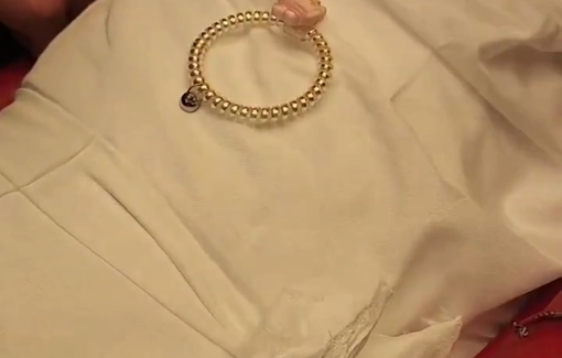 Thumbnail preview image for the video titled: Julia Al-Qedra was wrapped in a shroud and the clothes she was supposed to wear in Eid