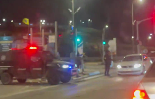 Thumbnail preview image for the video titled: Police stops Palestinian cars, but lets Israeli cars pass through. Apartheid par excellence.