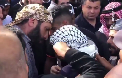 Thumbnail preview image for the video titled: Palestinians comfort the father of child Yusuf Kaabneh killed by Israeli soldier gunfire