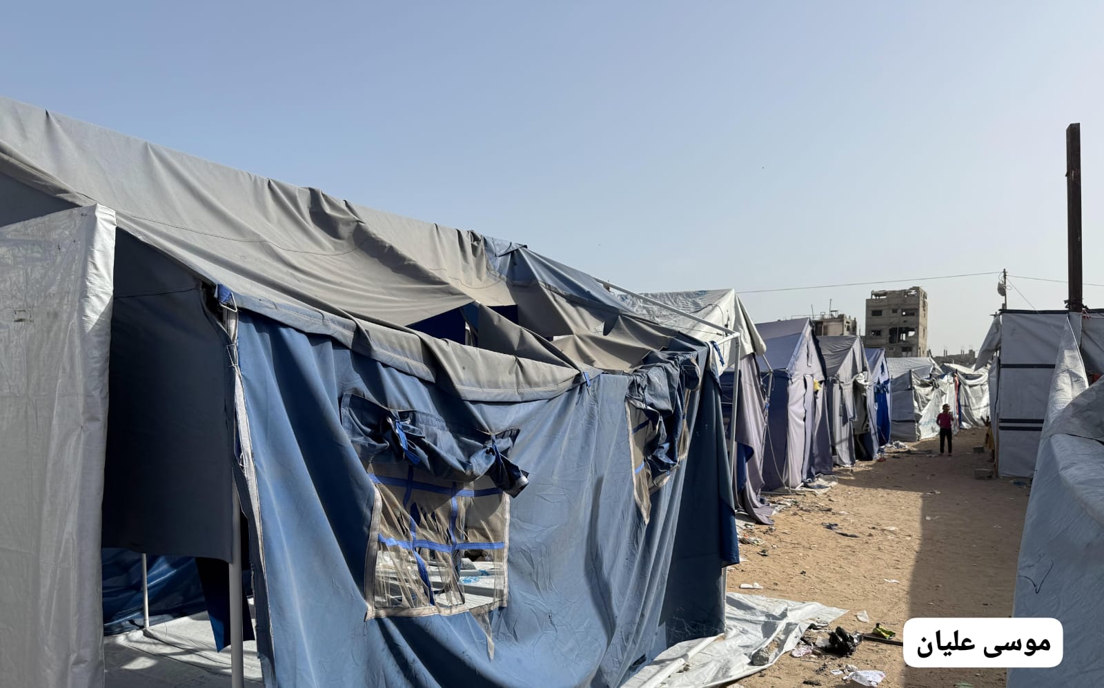 Thumbnail preview image for the video titled: Tents damaged by violent Israeli bombing of Al-Faluja area, North Gaza