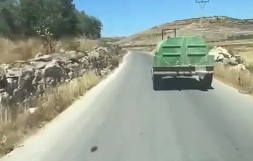 Thumbnail preview image for the video titled: Israeli settlers stole a Palestinian tractor with an attached water tanker from Abu Falah