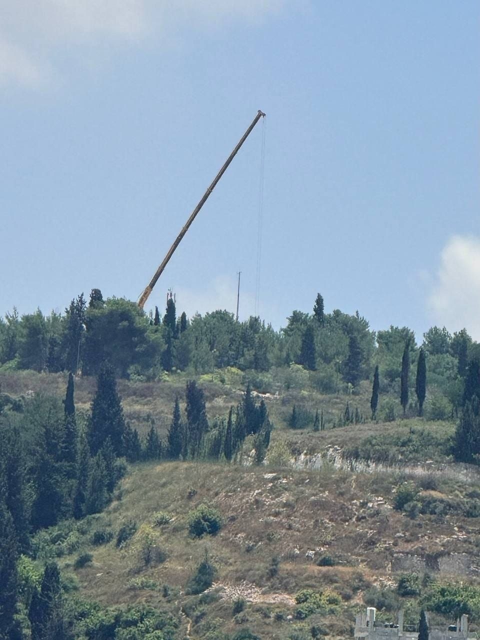 Thumbnail preview image for the video titled: Israeli forces installed a military tower for the Homs settlement in the West Bank