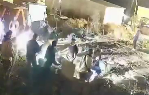 Thumbnail preview image for the video titled: Security footage of settlers attacking Andrey and Japser Nathaniel during their assault on Umm al-Khair