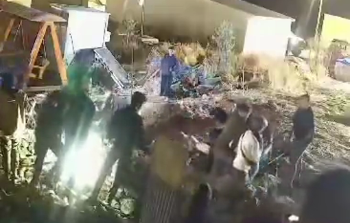 Thumbnail preview image for the video titled: Security footage of settlers attacking Andrey and Jasper Nathaniel during their assault on Umm al-Khair