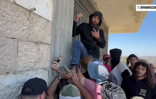 Thumbnail preview image for the video titled: Israeli settler stepping on activist’s neck, preventing him from fixing Palestinian home’s door