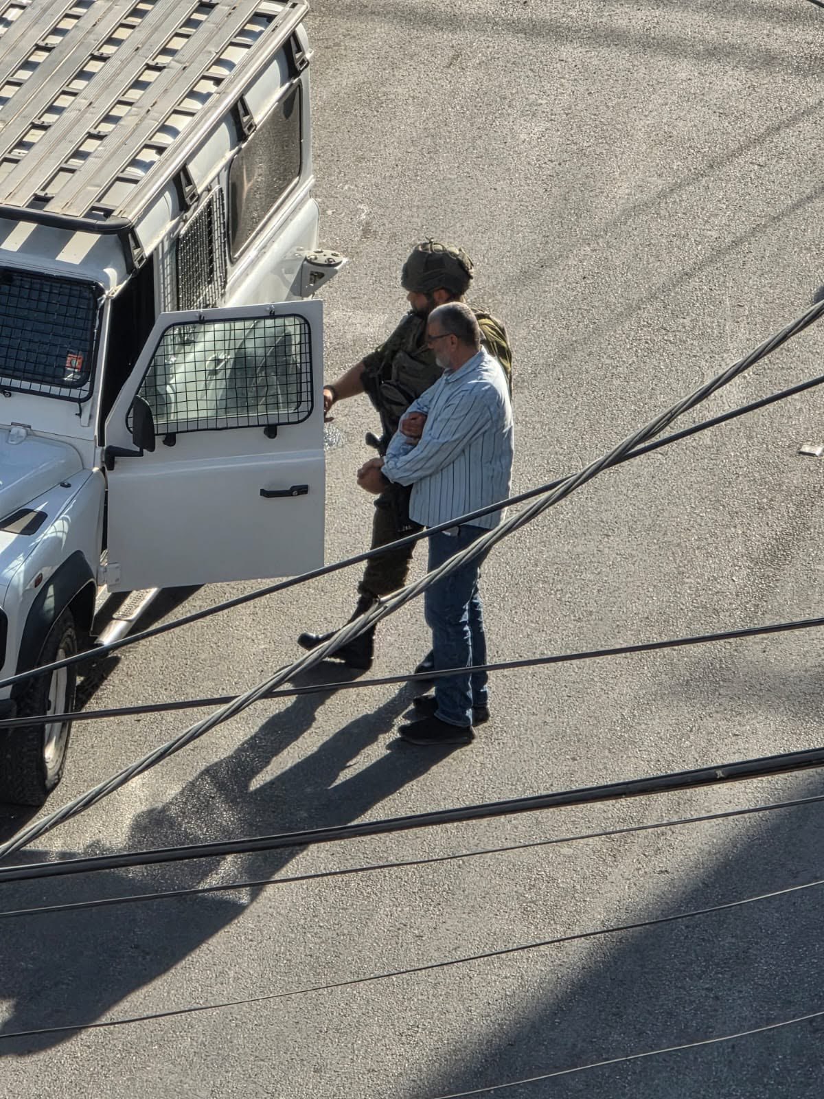 Thumbnail preview image for the video titled: Israeli forces arrest a citizen during their ongoing assault on Qalandia refugee camp