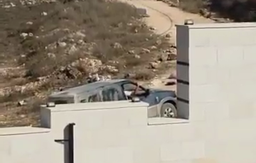 Thumbnail preview image for the video titled: Military vehicles pass by settlers who are moving around near the besieged houses—and the army does nothing