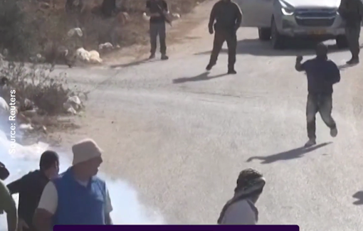Thumbnail preview image for the video titled: Israeli soldier suppress with stun grenade and tear gas farmers and activists picking the olive in Beita