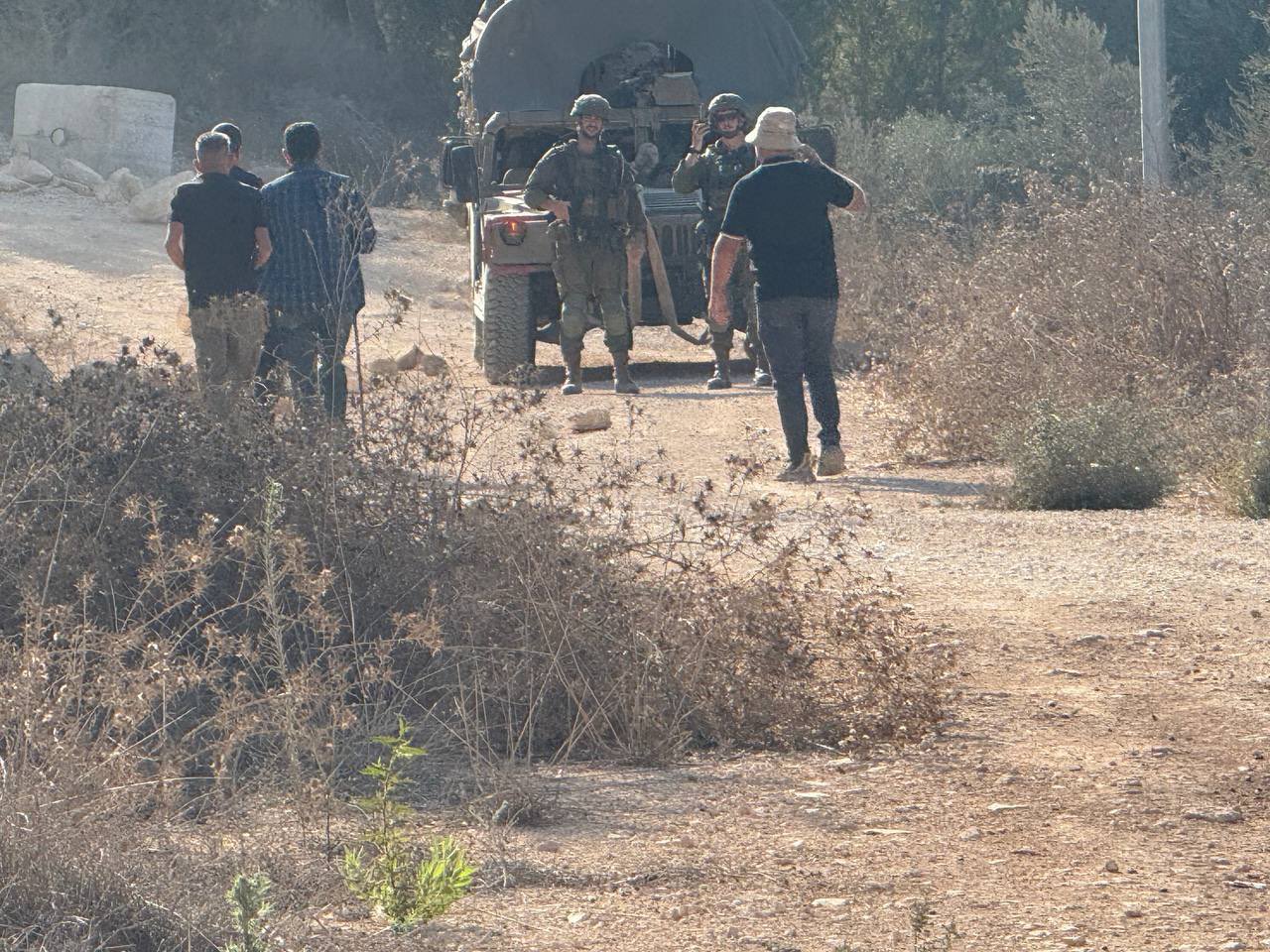 Thumbnail preview image for the video titled: Israeli forces prevent Palestinians from accessing their lands in Al-Dhahra area in Beita during the olive harvest